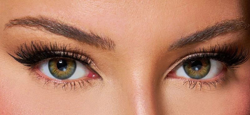 Front view of a model wearing hazel green colored contact lenses paired with dramatic lashes and soft glam makeup – a bold, mesmerizing look by KIISBEAUTY.