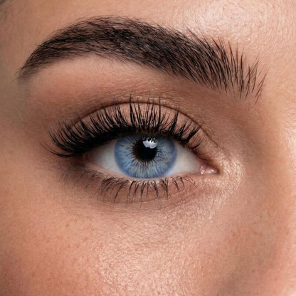 Leyla Ocean Blue colored contact lens on eye with bright blue tone and bold lash look